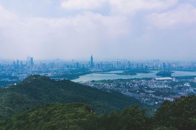 High angle view of buildings in city against sky