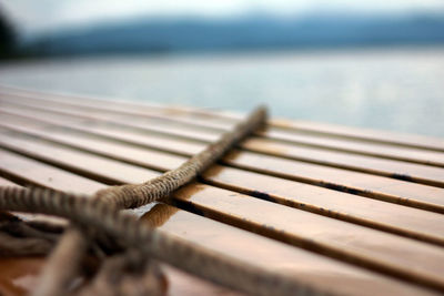 Close-up of rope tied on pier