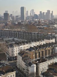 High angle view of buildings in city against sky