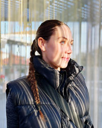 Portrait of young woman looking away