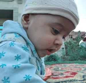 Close-up portrait of boy looking away