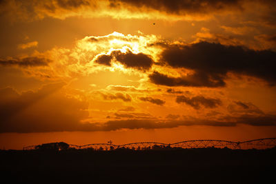 Scenic view of dramatic sky during sunset