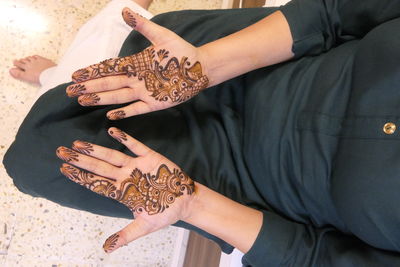 Midsection of man holding hands