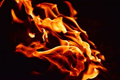 Close-up of bonfire against black background