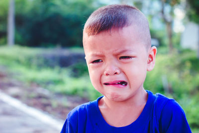 Boy looking away while crying