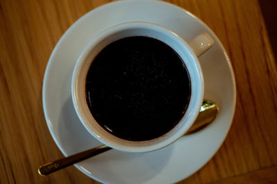 High angle view of black coffee on table