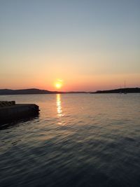 Scenic view of sea against sky at sunset