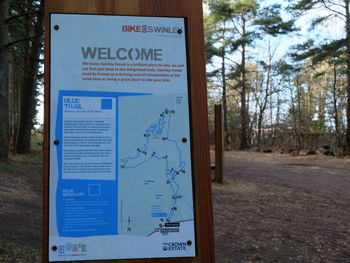 Close-up of information sign on field