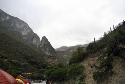 Scenic view of mountains against cloudy sky