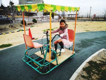 People sitting on chair in playground