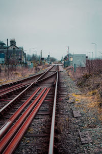 Railroad tracks against clear sky