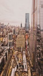 High angle view of buildings in city against sky