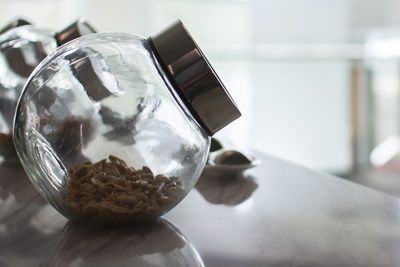 Peanuts in glass jars, soft light tones