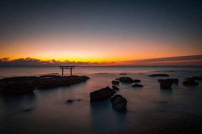 Scenic view of sea against sky during sunset