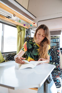 Woman traveling in camper van