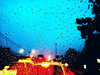 Close-up of wet window at night