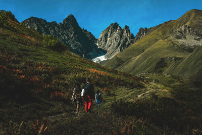 Hikers in khevsureti mountains.