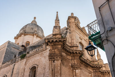 Low angle view of historical building against clear sky