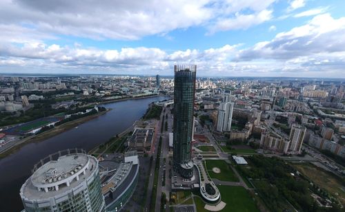 High angle view of city street and buildings against sky