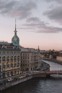 Vertical photo of cityscape of au pont rouge store, red bridge above moyka river. saint petersburg