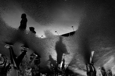 Silhouette of people against sky