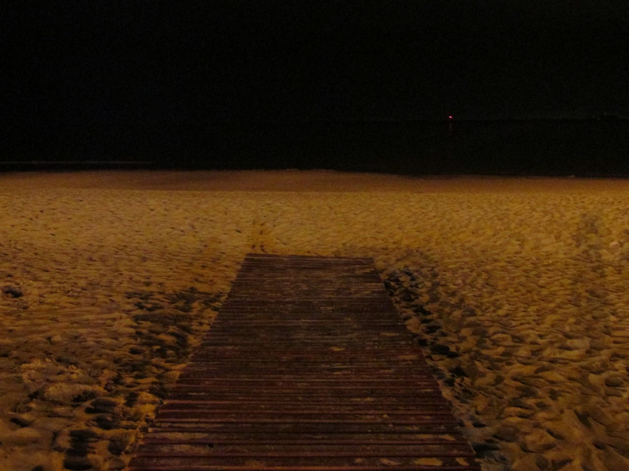 the way forward, tranquility, tranquil scene, clear sky, copy space, sand, beach, sea, nature, scenics, boardwalk, beauty in nature, night, transportation, outdoors, surface level, shore, landscape, water, pier