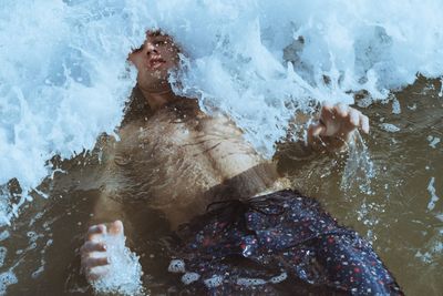 Portrait of man swimming in sea