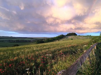 Scenic view of landscape against cloudy sky