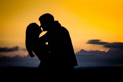 Silhouette of photographer at sunset