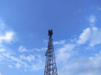 Low angle view of communications tower against sky