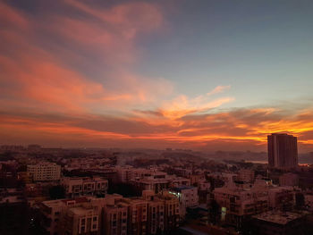 High angle view of city at sunset