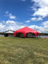 Built structure on field against sky