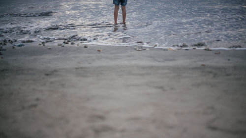 Low section of woman on beach