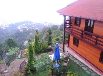 Houses on mountain against sky