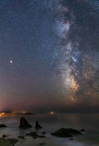 Scenic view of sea against sky at night