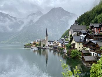 Panoramic view of buildings in town against sky