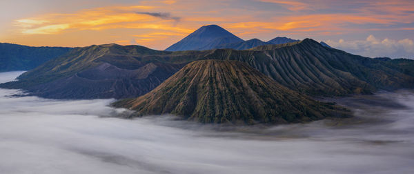 Panoramic view of volcanic landscape against sky during sunset