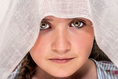 Close-up portrait of woman wearing veil