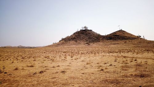 Scenic view of desert against clear sky