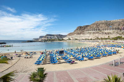 Scenic view of beach against blue sky