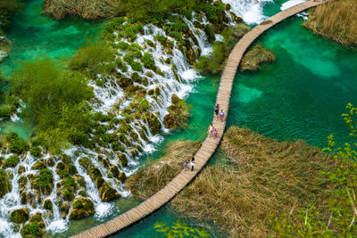 People on boardwalk at plitvice lakes national park