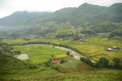 Scenic view of agricultural field and mountains