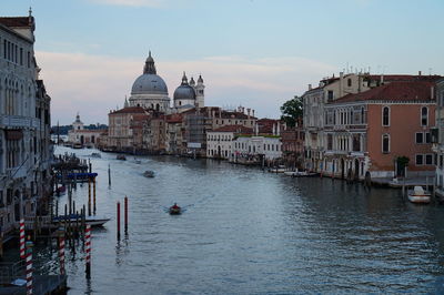 Santa maria della salute by grand canal against sky during sunset