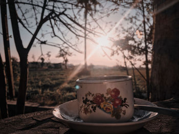 Close-up of food served on table against sky during sunset