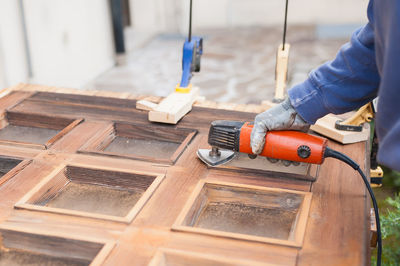 Low angle view of man working at construction site