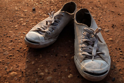 High angle view of shoes on field