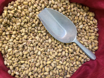 High angle view of nuts with serving scoop