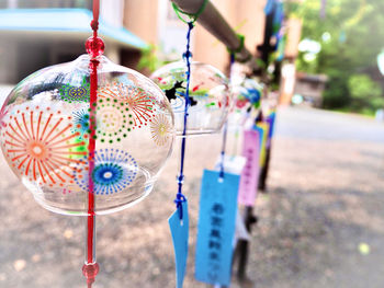 Close-up of decorations hanging on metal