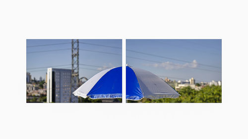 Panoramic view of tent and buildings against clear sky