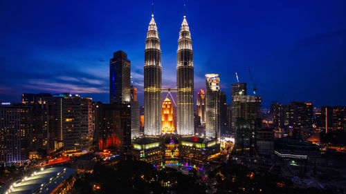 Illuminated buildings in city at night